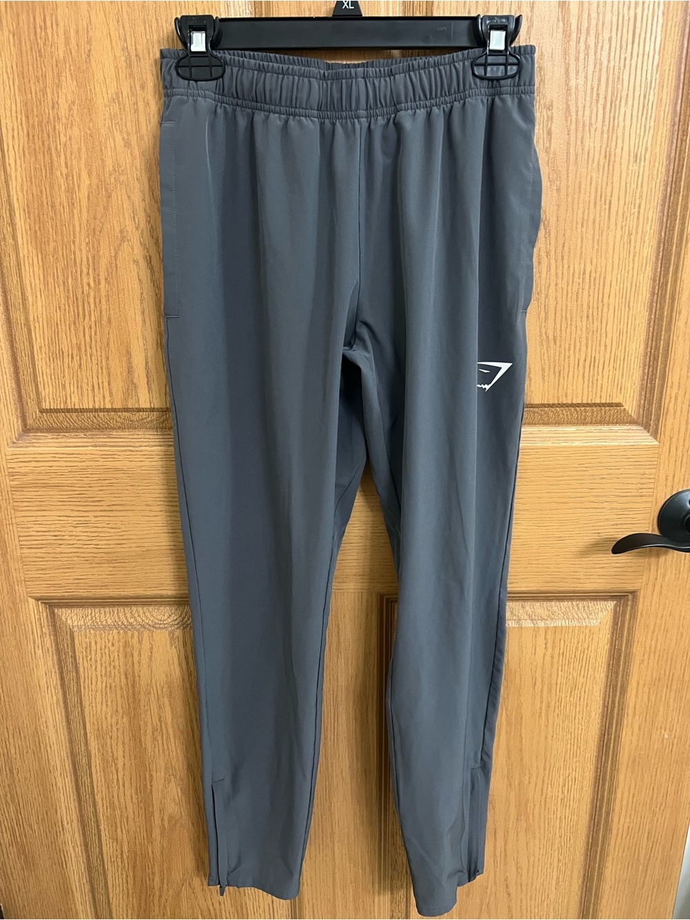 Woman’s Gymshark Arrival Woven Zip Hem Straight Taper Jogger Gray Size XS